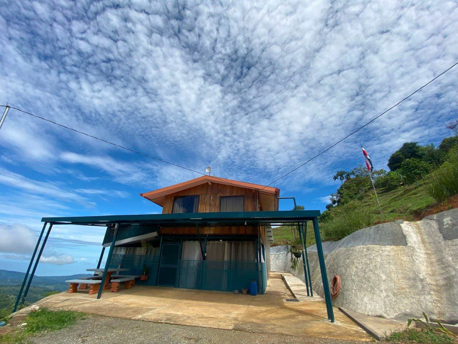 7.85 ACRES – Incredible Mountain and Ocean Views Rustic Home and Guest House, Many Fruit Trees, and More Building Areas on Top of the Mountain! photo 2