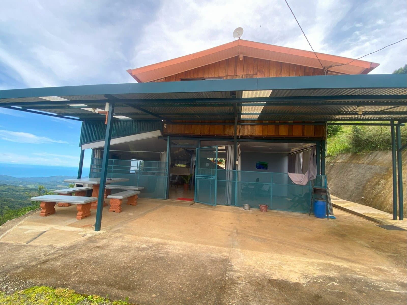 7.85 ACRES – Incredible Mountain and Ocean Views Rustic Home and Guest House, Many Fruit Trees, and More Building Areas on Top of the Mountain! photo 4