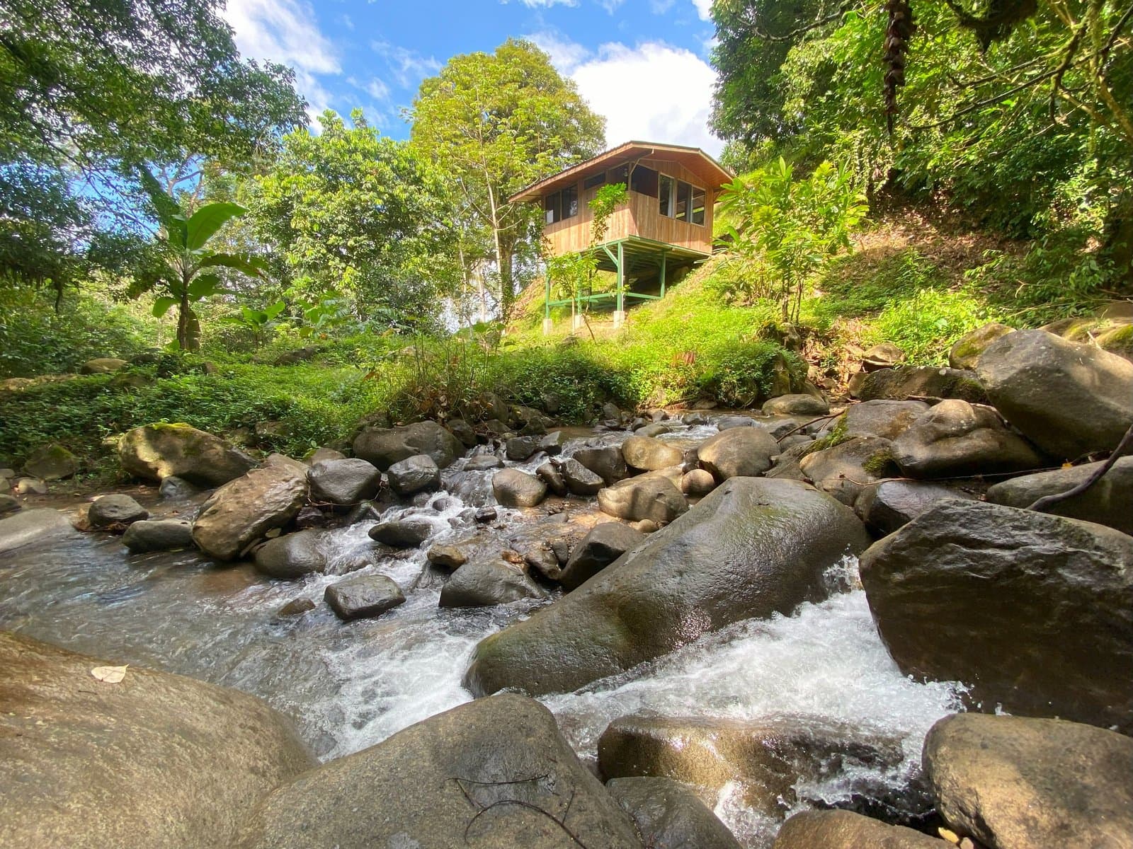 1.65 ACRES 3 Bedroom Tico Style House Plus 1-Bedroom Cabin by the River W Large Garden, Mountain Views And Room To Build More!