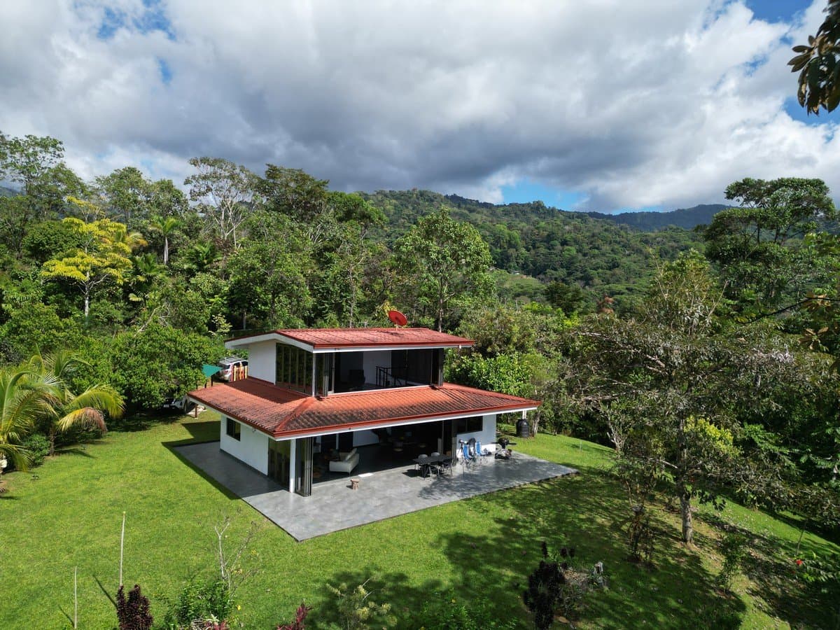 3.13 ACRES – 2 Bedroom Riverfront Home, Fruit Tress, Mountain Views & Partial Ocean View